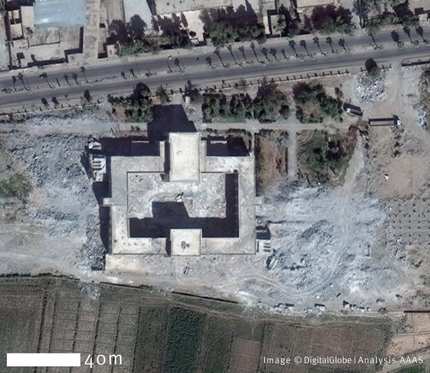 On April 8, 2011, the tombs of Uwais al-Qarani, Obay ibn Qays, and Ammar ibn Yasir, in the Syrian city of Raqqa, were undamaged. By October 6, 2014, however, all the tombs had been demolished, while leaving the roof of the central mosque intact. Damage to the building’s interior decorative flooring is visible. Coordinates: 35.94 N, 39.02 E. Image ©DigitalGlobe | U.S. Department of State, NextView License | Analysis AAAS