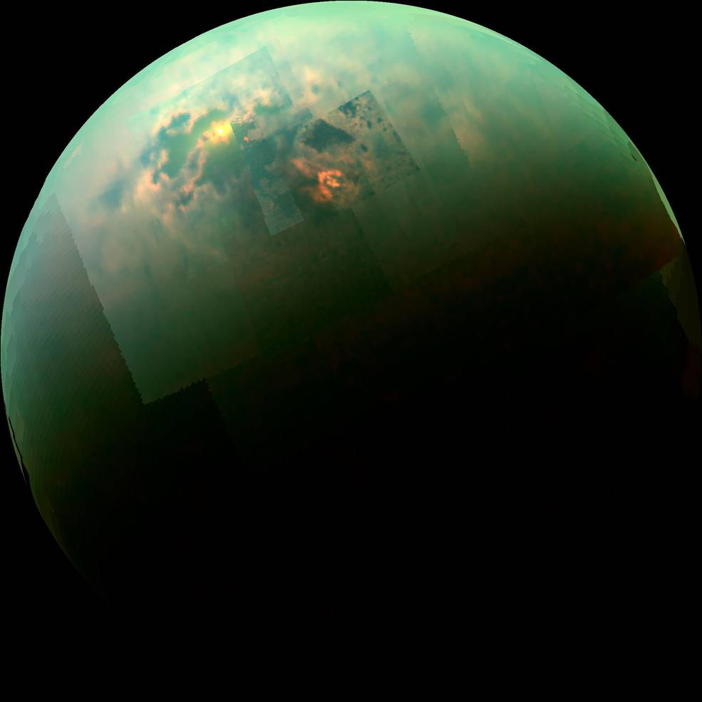 Sunlight glints off of Titan's northern seas this near-infrared, color mosaic from NASA's Cassini spacecraft. Credits: NASA/JPL/Univ. Arizona/Univ. Idaho