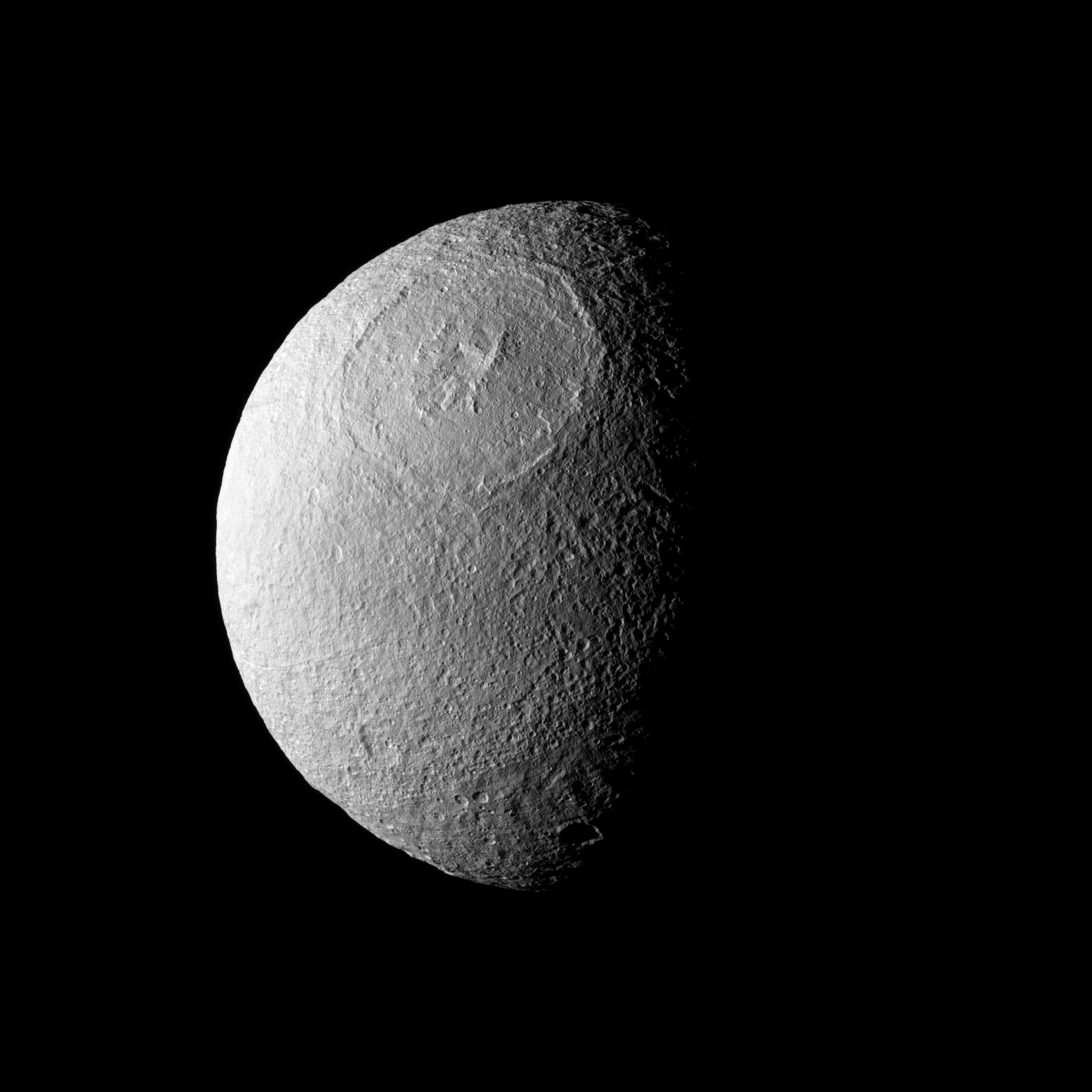 Odysseus Crater, with a size of epic proportions, stretches across a large northern expanse on Saturn's moon Tethys. Credit: NASA/JPL/Space Science Institute