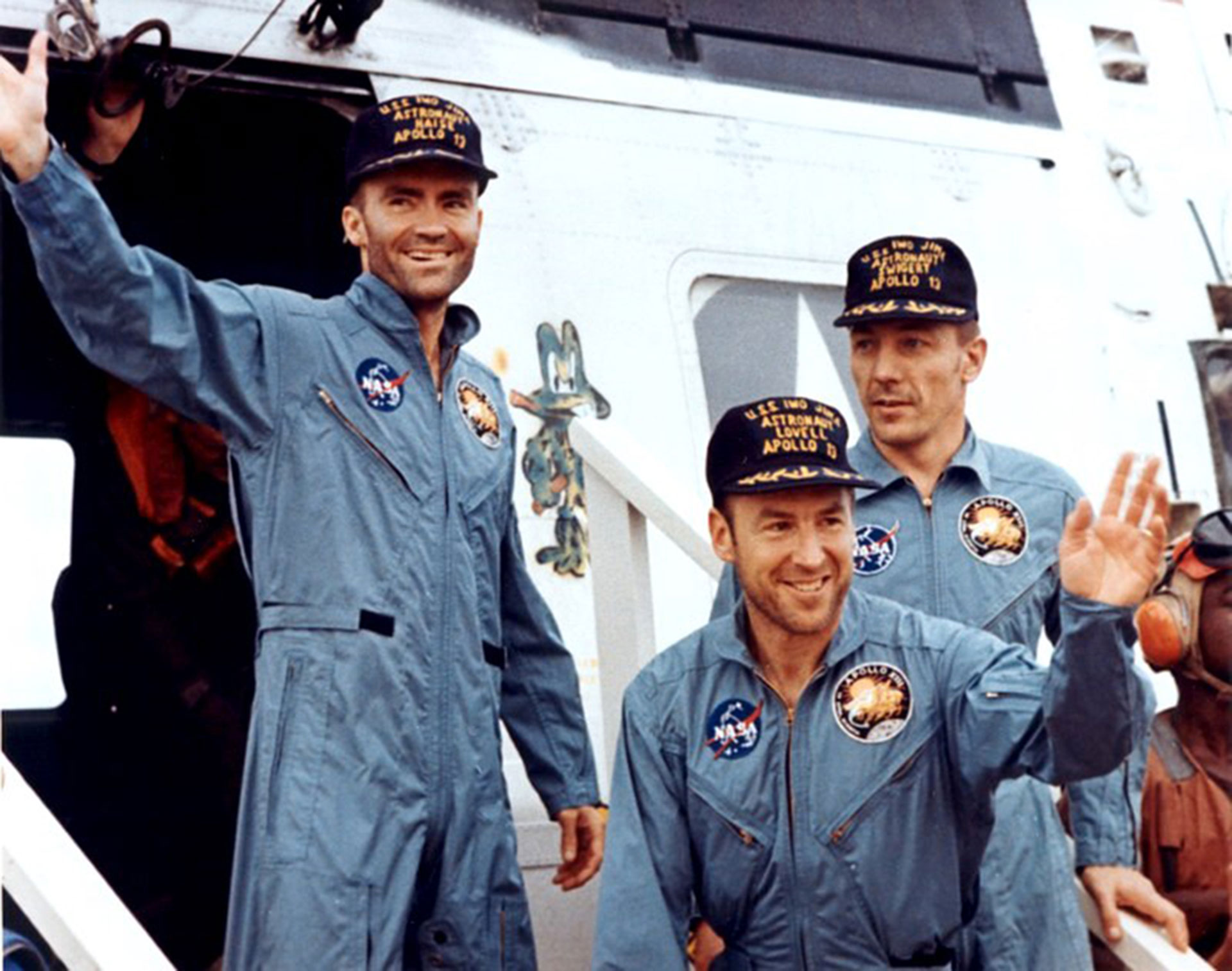 The crewmembers of Apollo 13—Fred Haise (left), Jim Lovell, and Jack Swigert—step aboard the "USS Iwo Jima" following splashdown and recovery operations in the south Pacific Ocean on April 17, 1970. Credit: NASA