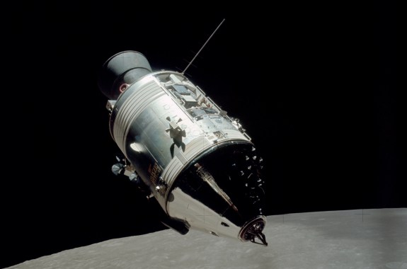 the conical shaped command module in orbit above the moon
