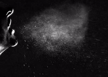 Slow motion video of sneeze spraying