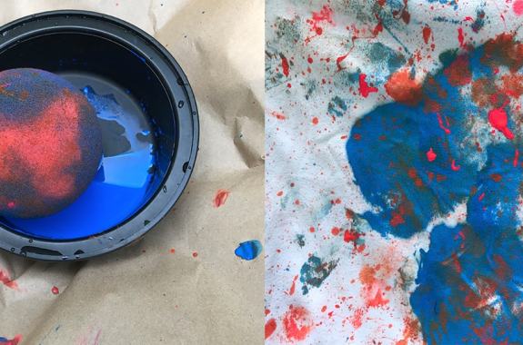 On one side of the image is a sponge sitting in a dish of paint. On the the side are blotches and splatter on a canvas.