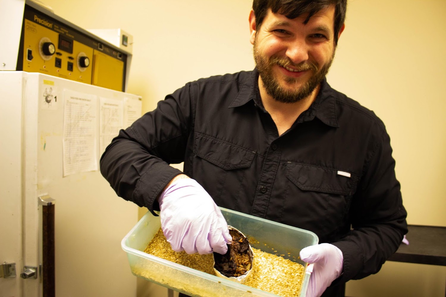 gantz holding up the bin of maggots
