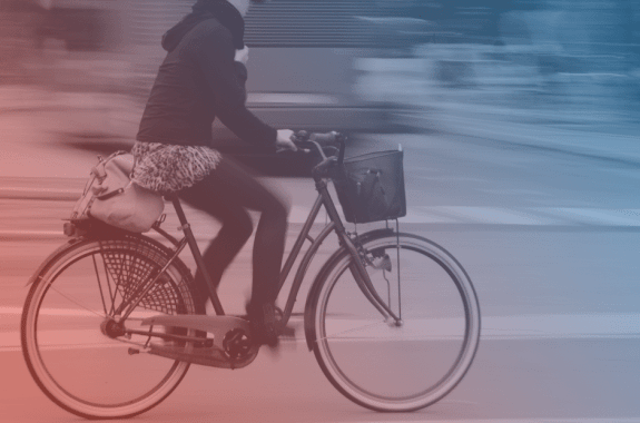 biker in a city, blue and red filter