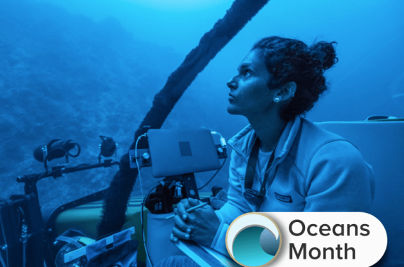 deep sea researcher diva amon in a submersible in the deep sea, completely shaded in blue