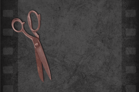 grayish black film strip with red tinted scissors on top to the left