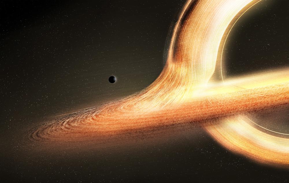 a planet glows from a nearby radiant black hole. there are streams and jets of light circling a black center
