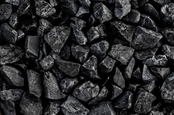 close up image of black coal chunks in a pile
