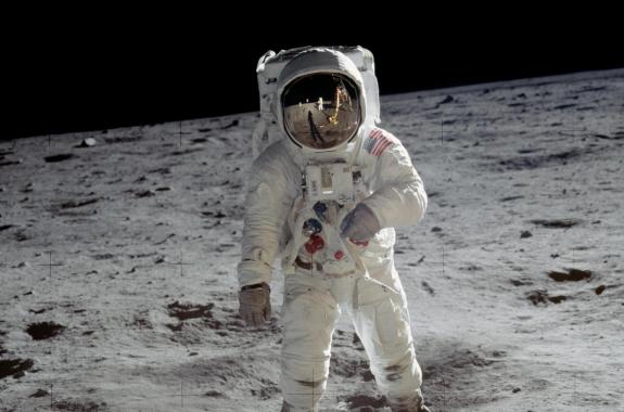 an astronaut stands on the moon