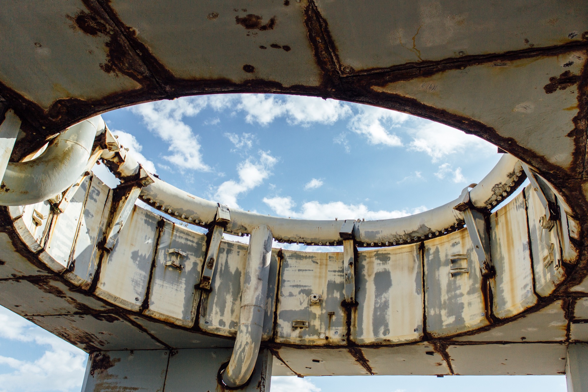 looking at the top of the rusted launch table, where there is a large ring at the top