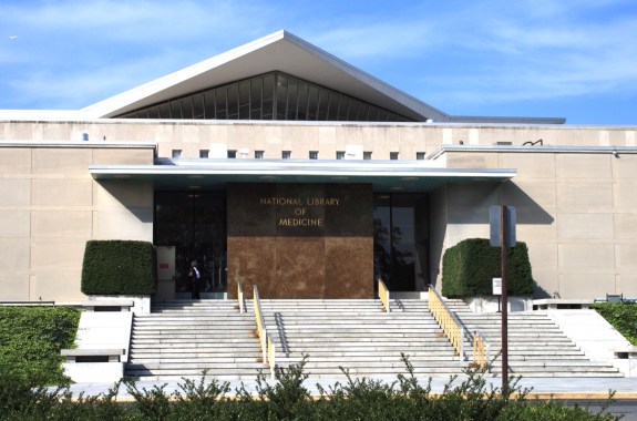 the front of a large building with a pointed roof