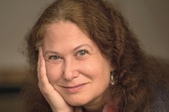 a white woman with her hand on her cheek