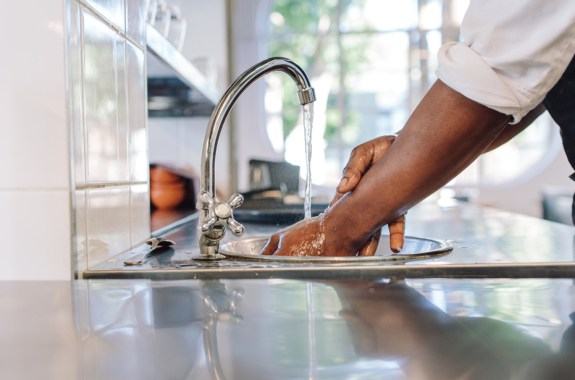 a person washing hands