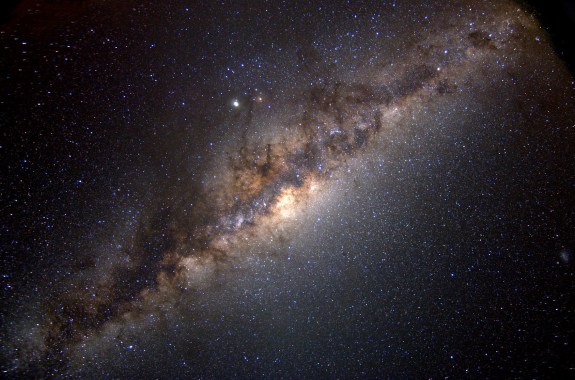 a starfield with a linear stretch of clouds, showing the galaxy