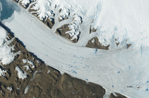 an aerial view of a glacier's movement and its deposit melt