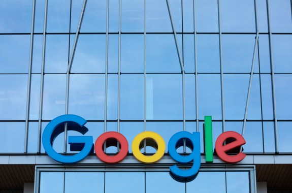 a glass building with the google sign and logo