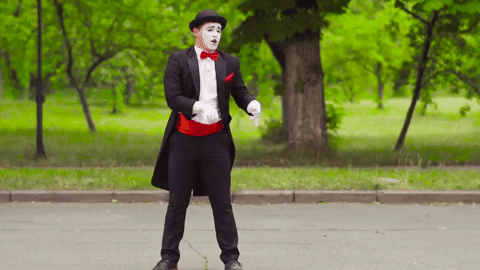 a mime in a tux and bowler hat pulls another mime with an invisible rope