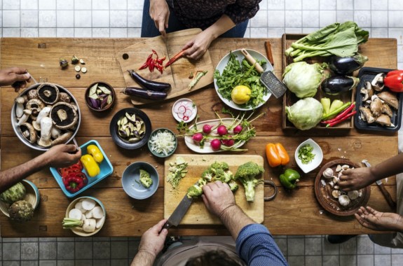 Aerial view of people with fresh vegetables preparing to cook