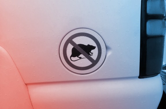 a logo of a black rat silhouette crossed out with a red sign on the side of a car