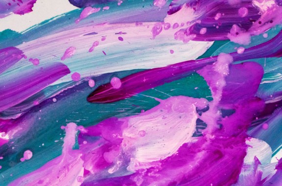 a lush abstract splatter painting made up of a light and dark purple, and different shades of blue and white