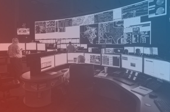 ERCOT workers sitting at the power grid monitors.