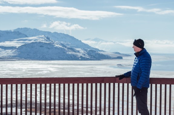 Kevin Perry atmospheric science university of utah in front of a beautiful mountain and the exposed Great Salt Lake lakebed