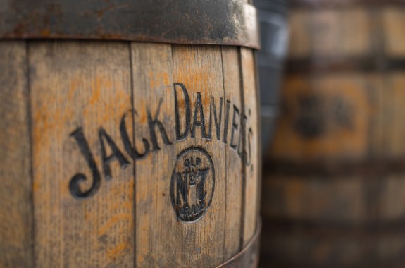 Burned logo of the famous Jack Daniel's whiskey at the old wooden barrel.