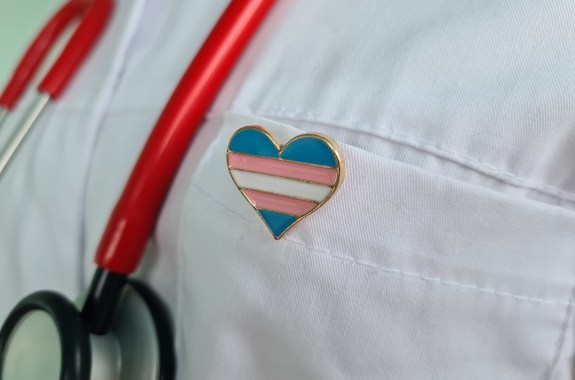 Transgender LGBT symbol stethoscope with trans pride icon for rights and gender equality. Medical care insurance and doctor