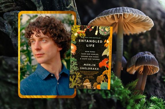 Event promotional image. To the left of the frame is a picture of ENTANGLED LIFE book cover and a headshot of author Merlin Sheldrake, a white man with curly brown hair. The background features a few brown mushrooms growing out of moss near a tree.