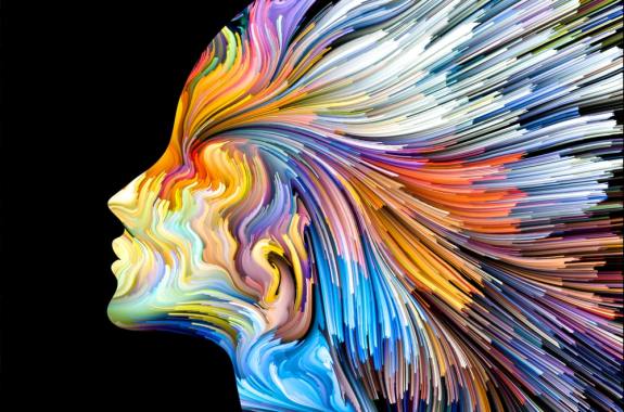an artistic representation of a profile of a woman - her silhouette is made of streaks of color swirling outward from her mind