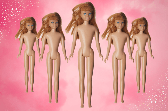 five barbies lined up in a "V" formation with a bright pink background
