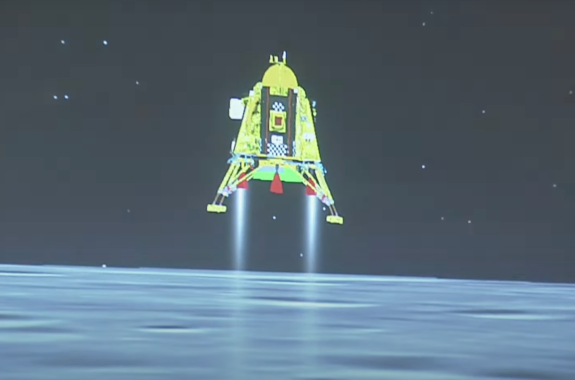 A spacecraft landing on the moon.