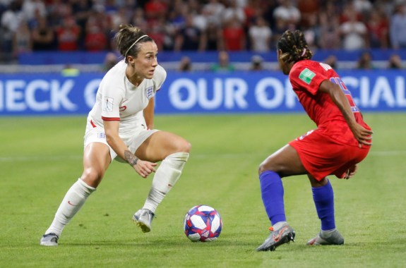 two female soccer players face off