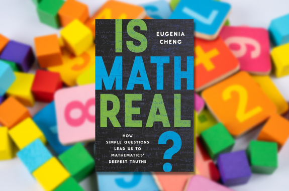 Is Math Real? book Cover overlaid against building blocks with numbers on them