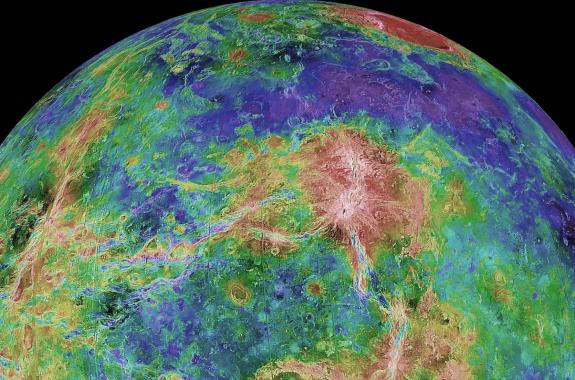 A half-circle with bright purples, greens, yellows blues, and reds depicting topography, against a black background.