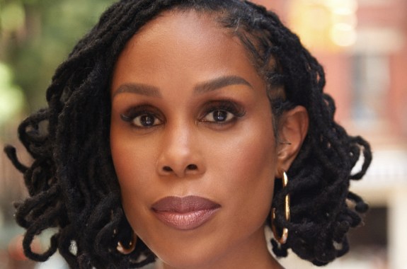 A black woman's face looking into the camera.