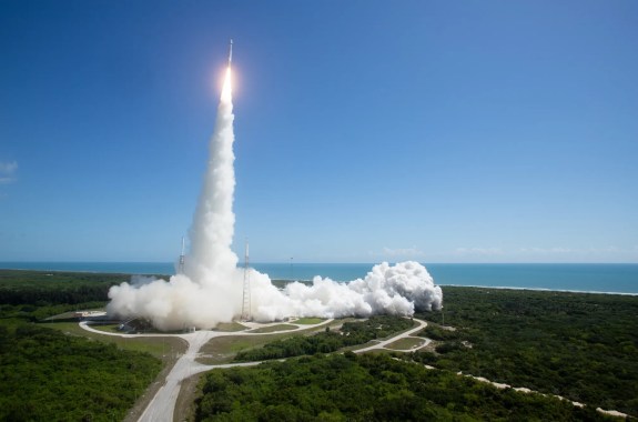 A rocket launches into the sky from a launch base in Florida.