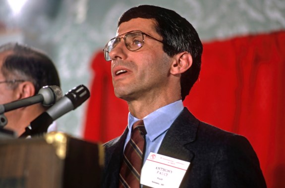 A man speaking into a microphone at a conference