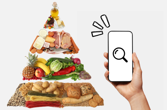Someone holding a phone in front of a food pyramid