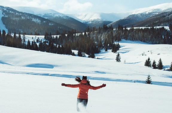 A person running on a snowy mountain