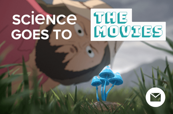 A man wearing a bucket hat staring at a bright blue mushroom