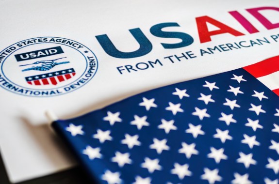 USAid logo letterhead and US flag in foreground