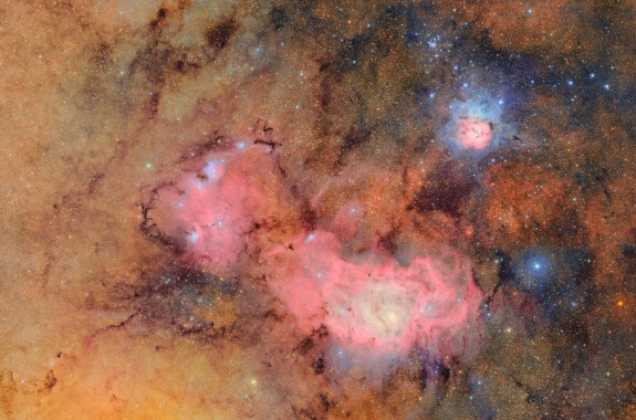 A beautiful view of two nebulas swirling in space