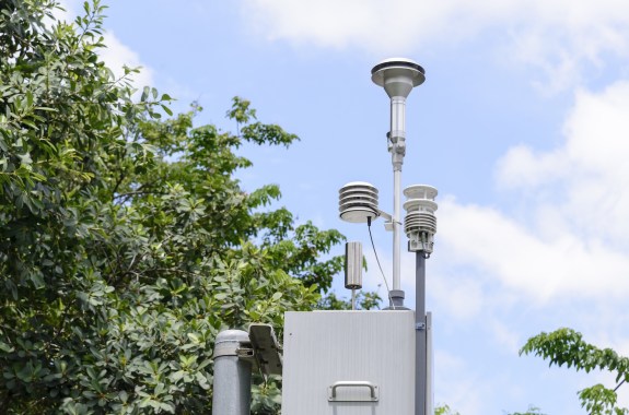Some metal objects on a tall pole