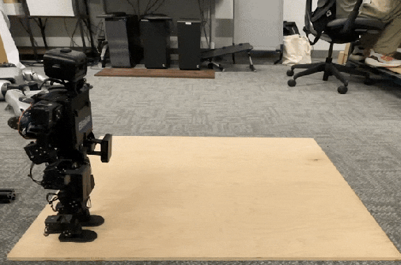 A small robot does a cartwheel