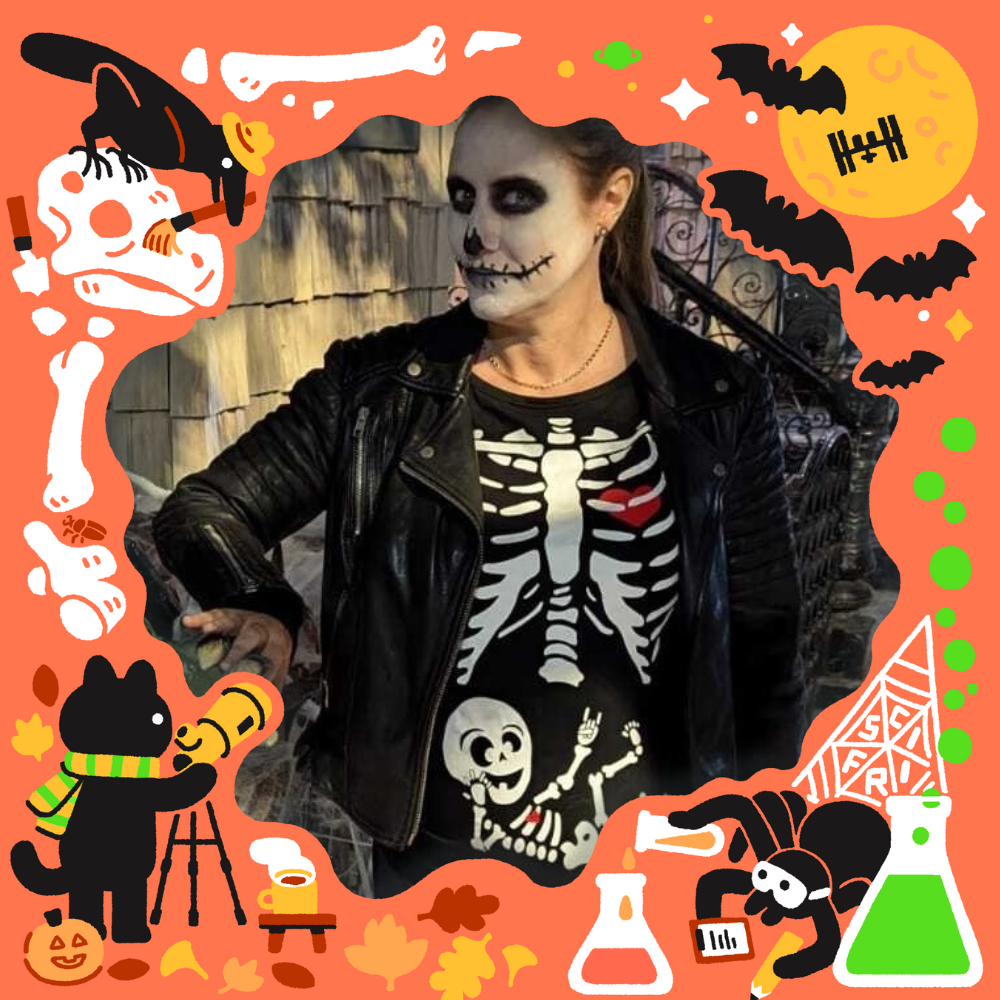 A woman dressed as a skeleton, with a baby skeleton on her stomach.