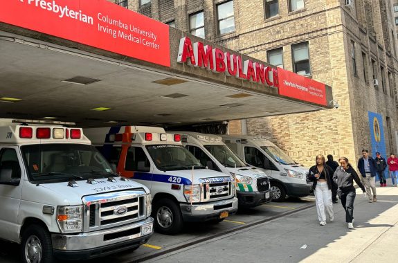 Ambulances parked at a hospital in NYC. Public health, CDC gaps.