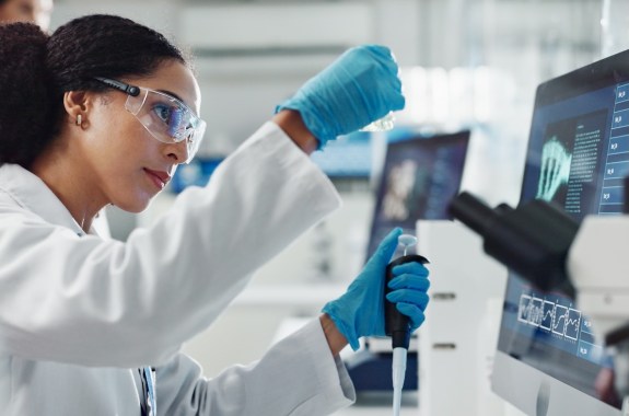 Glass vial, pipette and woman scientist in laboratory for medical study, research or experiment. Test tube, dropper and professional female person with chemical liquid for pharmaceutical innovation. AI in medicine, technology